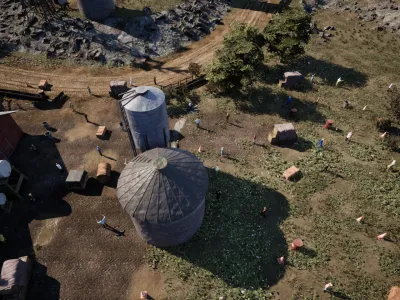 The silos and the barn roof from low over the yard, with the track curving past