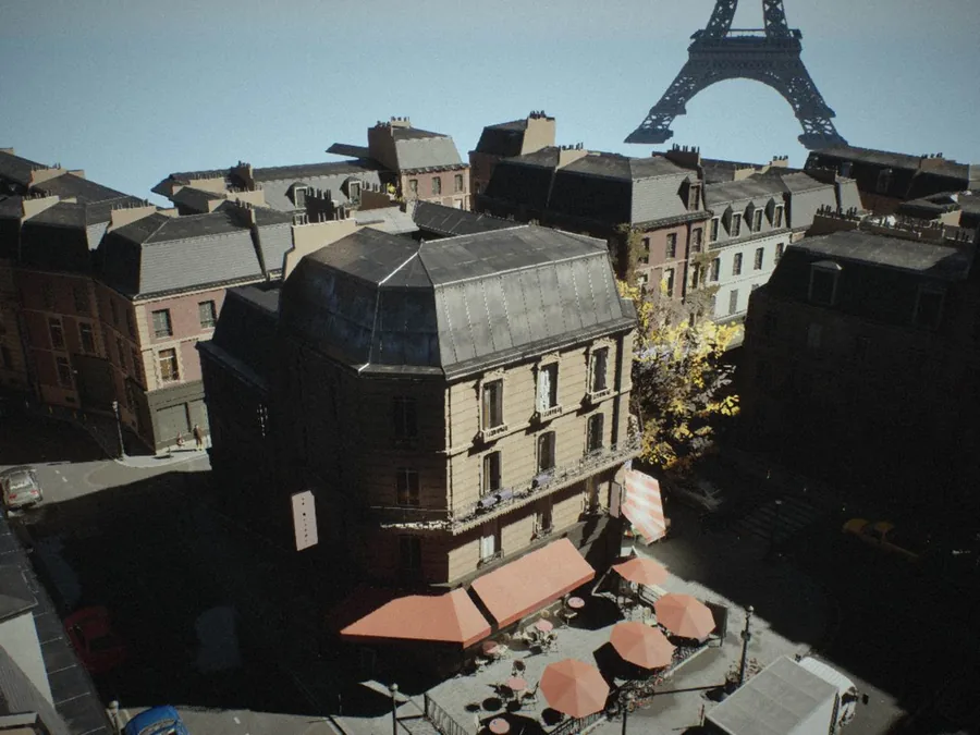 Parisian street: a clear morning over the corner terrace, with the tower behind the rooftops and hard shadows across the street
